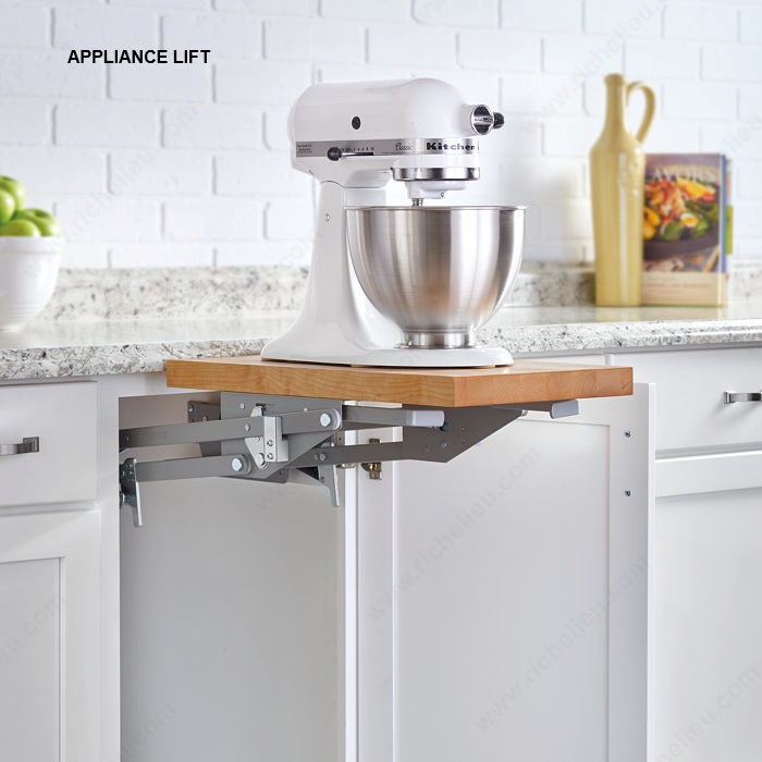 Cabinet appliance lift supporting a countertop appliance